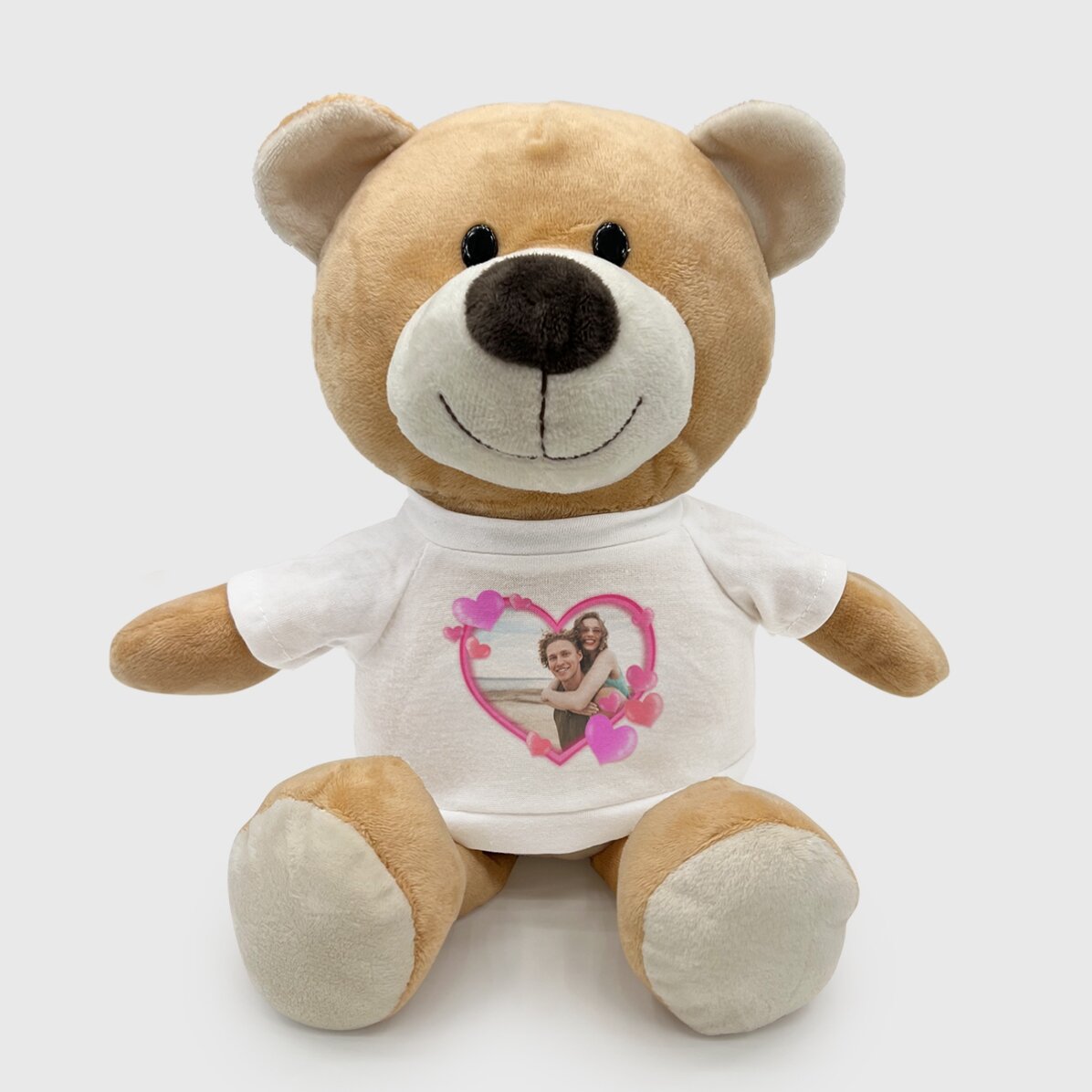 Außerdem ein personalisiertes Teddybärchen mit einem Foto und Herzchen